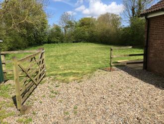 Gate to village hall car park